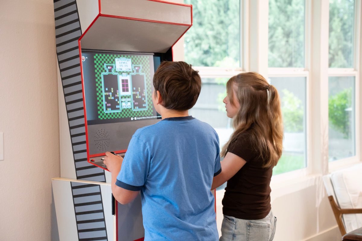 Two people playing Swap Arcade